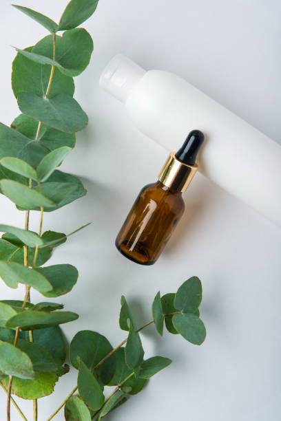 istock green eucalyptus leaves with tubes on a white background, beauty care 1209817215