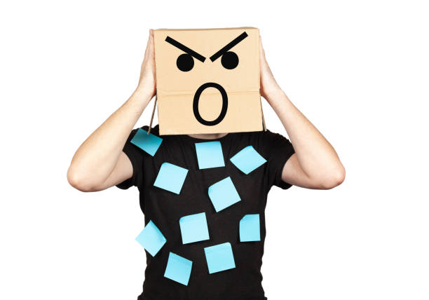 istock Businessman in despair with a box on his head with screaming emotion. Stress, problems and collapse 1209819610