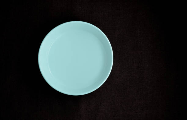 istock bowl blue pastel on clothing black background 1209821258