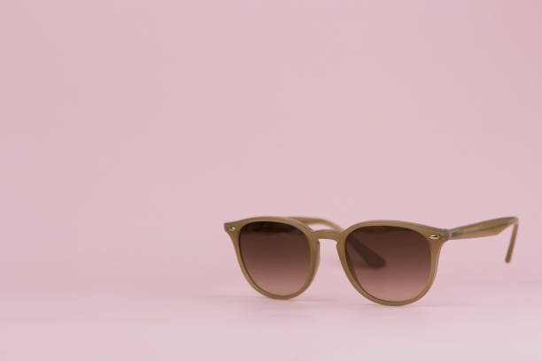 istock Brown sunglasses on a pink background. Background 1209827488