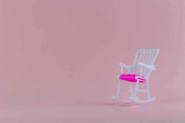 istock Toy rocking chair on a pink background 1209827500