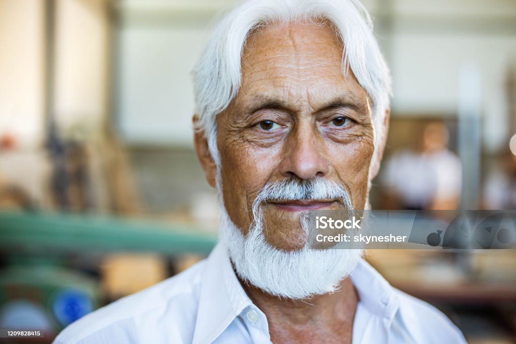 Portrait Of A Mature Man With White Hair And Beard Looking At Camera Stock  Photo - Download Image Now - iStock