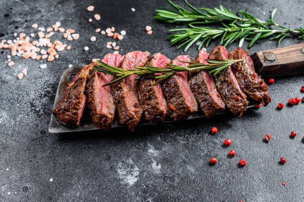 istock Grilled top blade, Denver steak. Marble meat beef. Black background. Top view 1209829436