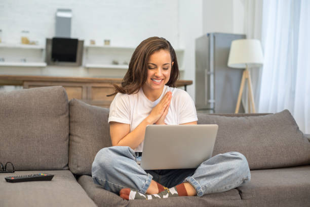 istock Happy joyful woman working with gadget at home 1209830658