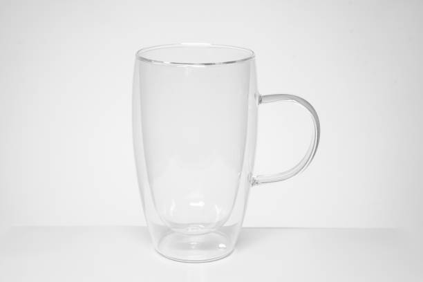 istock empty tea or coffee mug made of double transparent glass 1209830909