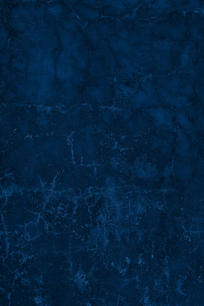 istock fantastic dark blue painted wall with cracks and peeling paint flakes 1209834430