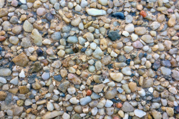istock Texture of small colored pebbles on the beach 1209834934