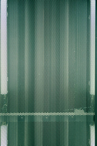 istock Background of a metal irregular lattice with a curved surface 1209837363
