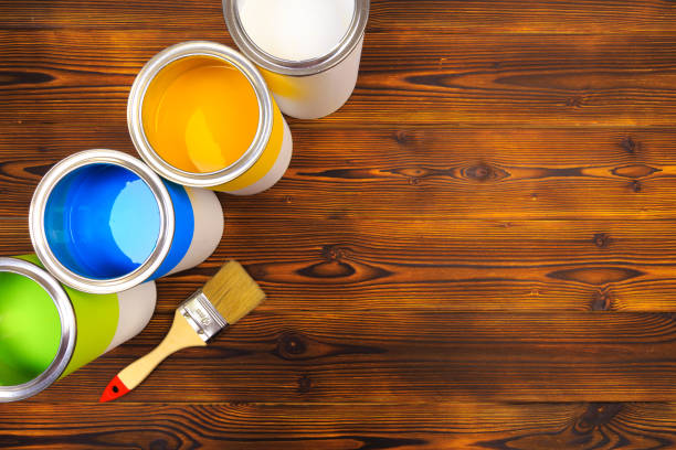 istock House renovation, paint cans on the old wooden background with copy space 1209837549
