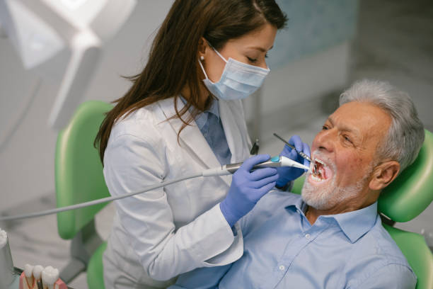 istock Senior man at the dentist 1209838053