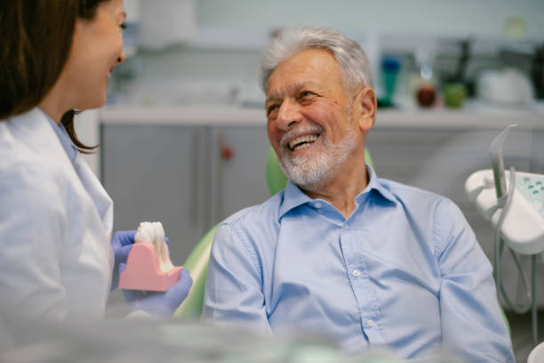 istock Senior man at the dentist 1209838132