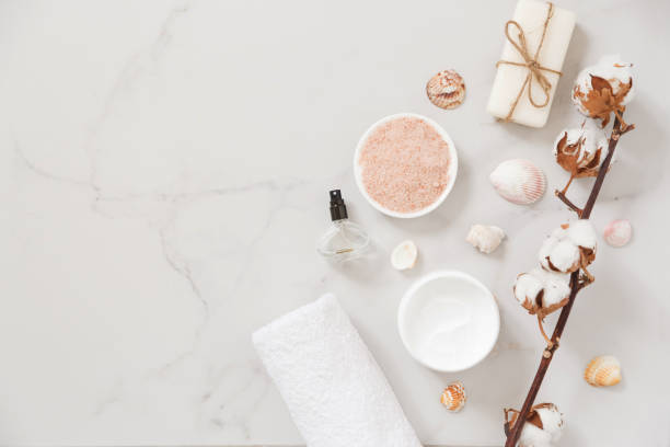 istock Spa cosmetics set on white marble background from above. Beauty blogger concept. Copy space 1209838812