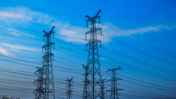 istock High voltage power tower and beautiful landscape at sunset 1209839197
