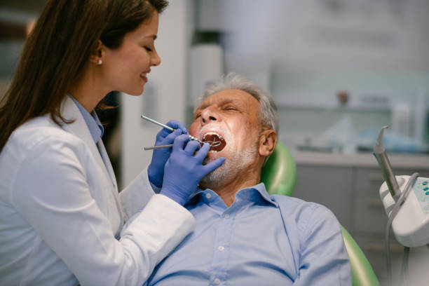 istock Senior man at the dentist 1209839213