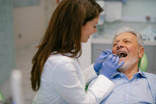 istock Senior man at the dentist 1209839241