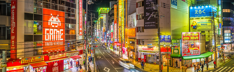 Neon lights and crowded streets of Denden Town at night in the heart of Osaka, Japan’s vibrant second city.