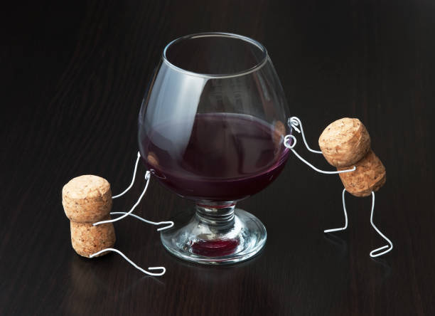 istock corks and a glass of wine 1209840319