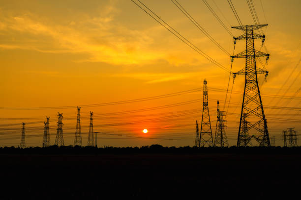 High voltage power tower and beautiful nature landscape at sunset