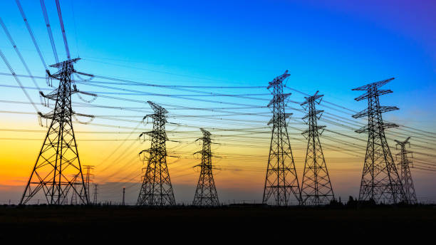 istock High voltage power tower and nature landscape at sunset 1209840654