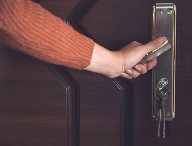 istock woman open the door 1209841244