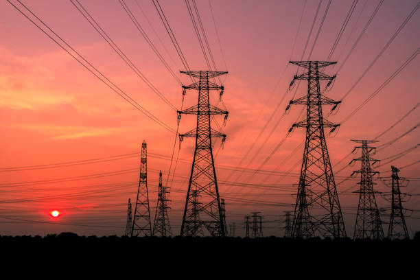 istock High voltage power tower and nature landscape at sunset 1209841248