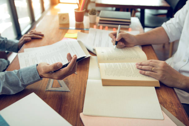 istock Teenager studying at desk and doing homeworks 1209841434
