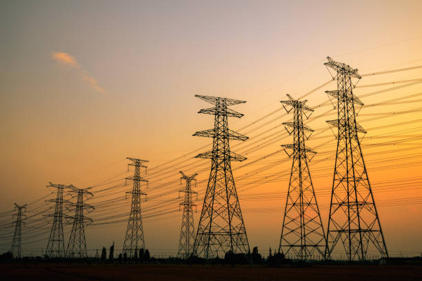 istock High voltage power tower and nature landscape at sunset 1209842054