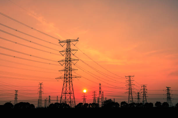 istock High voltage power tower and nature landscape at sunset 1209842820