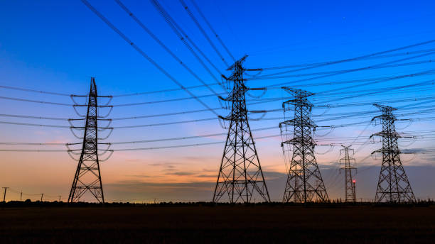 istock High voltage power tower and nature landscape at sunset 1209842823
