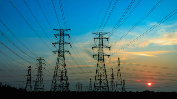 istock High voltage power tower and nature landscape at sunset 1209843498