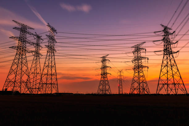 istock High voltage power tower and nature landscape at sunset 1209843823