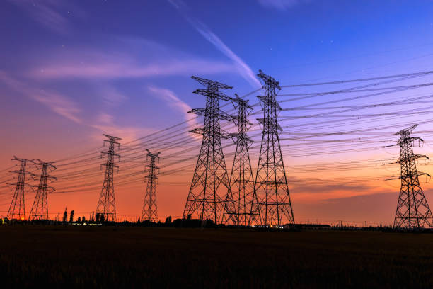 istock High voltage power tower and nature landscape at sunset 1209846169