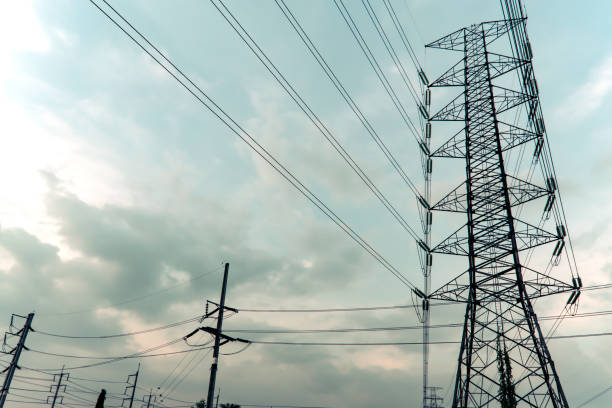 istock Electricity pole against blue sky clouds in dawn time 1209846415