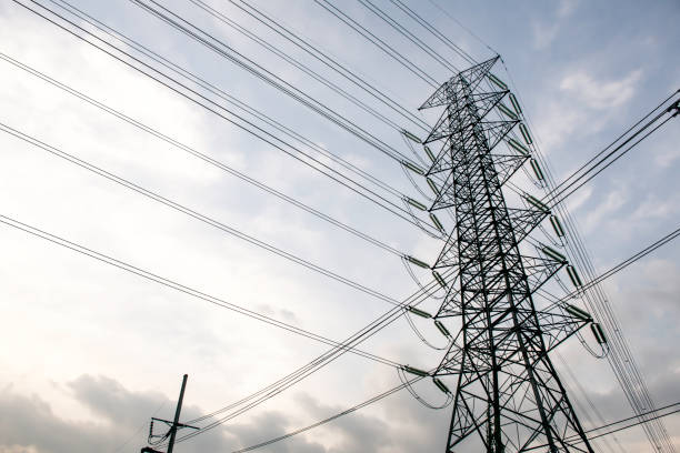 istock Electricity pole against blue sky clouds in dawn time 1209846440