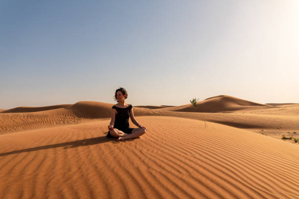 istock Yoga pose in the desert 1209846815