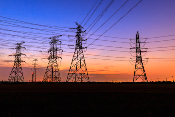 istock High voltage power tower and nature landscape at sunset 1209848337