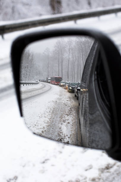 istock Bad road conditions during heavy snowfall 1209848412