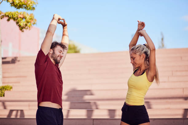 istock Modern couple doing exercise in urban area. 1209848722