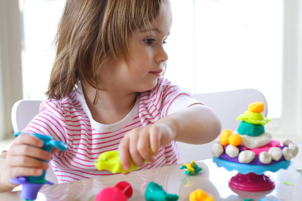 istock Girl playing with play dough 120984876