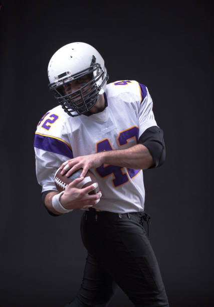 istock American Footballer running fast 1209849858