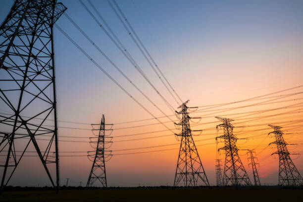 istock High voltage power tower and nature landscape at sunset 1209850617