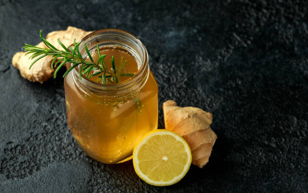 istock Kombucha Ginger, lemon Tea in jar. healthy drink 1209851348