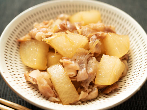 Simmered Daikon Radish & Pork Belly Simmered Daikon Radish & Pork Belly dikon radish stock pictures, royalty-free photos & images