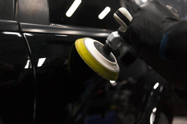 istock Car body polishing process at the detailing workshop 1209852179
