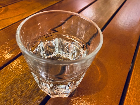 A glass of water on table.