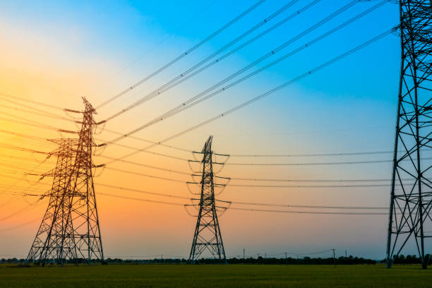 istock High voltage power tower and nature landscape at sunset 1209854051