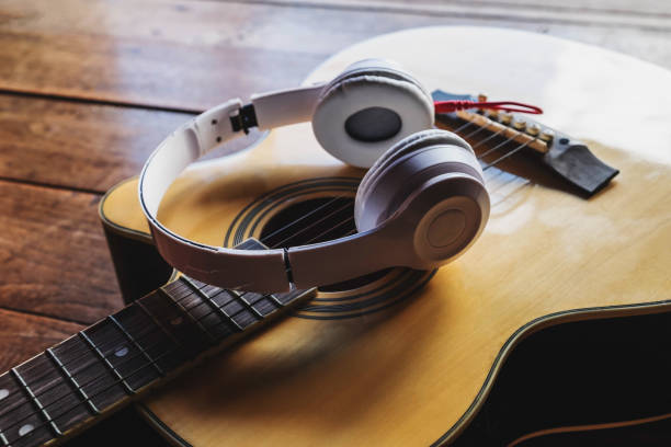 istock Classical guitar and music headphones 1209855182