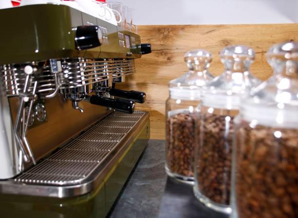 istock hot coffee and coffee beans on the background of coffee grinders 1209855211