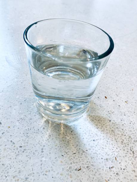 istock Glass of Water on Table 1209855296