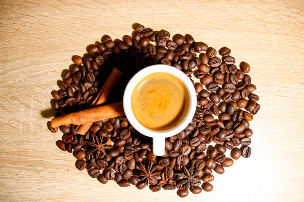 istock A cup of coffee with heart pattern in a white cup on wooden background 1209855329